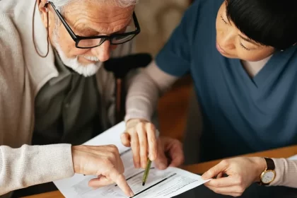 senior couple reviewing Medicare health insurance documents 2026