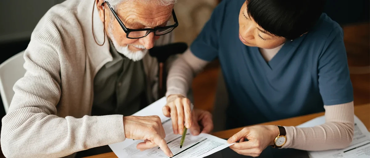 senior couple reviewing Medicare health insurance documents 2026