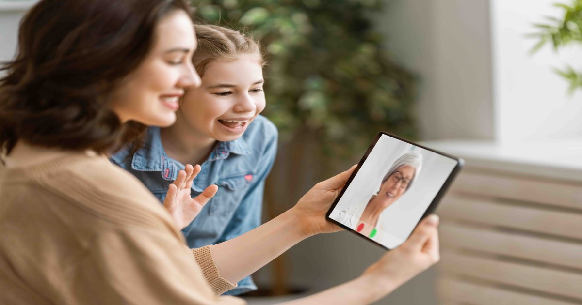 Adult child on video call with elderly parent - long-distance caregiving support